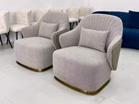 Fauteuil individuel de salon avec dossier coquille, base métallique et coussin circulaire, pour ensemble de mobilier de salon