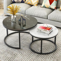 Table basse ronde moderne pour salon, ensemble de 2 tables gigognes avec plateau en marbre noir et blanc pour usage domestique.