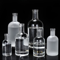 Bouteille à liqueur cylindrique en verre à fond épais transparent pour usage professionnel en bar