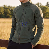 Veste coupe-vent pour homme, idéale pour les sports d'hiver, la randonnée et les activités de plein air, en gris, noir et vert OD, avec doublure en polaire tactique.