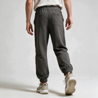 Pantaloni da jogging da uomo grigio oliva affusolati con polsini a costine, nastro laterale verticale, cintura con coulisse, tasche inclinate con occhielli