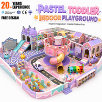 Nouvelle structure de jeu d'intérieur pour enfants 2026 : Piscine à balles, toboggan en spirale, piste de course et structure d'escalade sur le thème des couleurs pastel, personnalisable