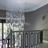 Lustre cascade vertical ANNO personnalisé en forme de feuille, luminaire suspendu pour hall d'hôtel de luxe et escalier de villa