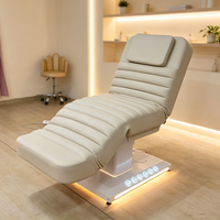 Table de Massage Moderne en Cuir à Base Blanche, Lit de Spa Électrique à 3 Moteurs avec Lumières LED pour Soins Esthétiques et Faciaux