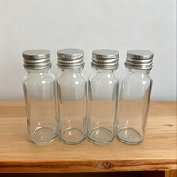 Botella de jugo de vidrio transparente vacía de 50ml con rosca continua Anillo de tapón de rosca de agua Botellas de disparos de molinillo de vidrio redondo largo y delgado