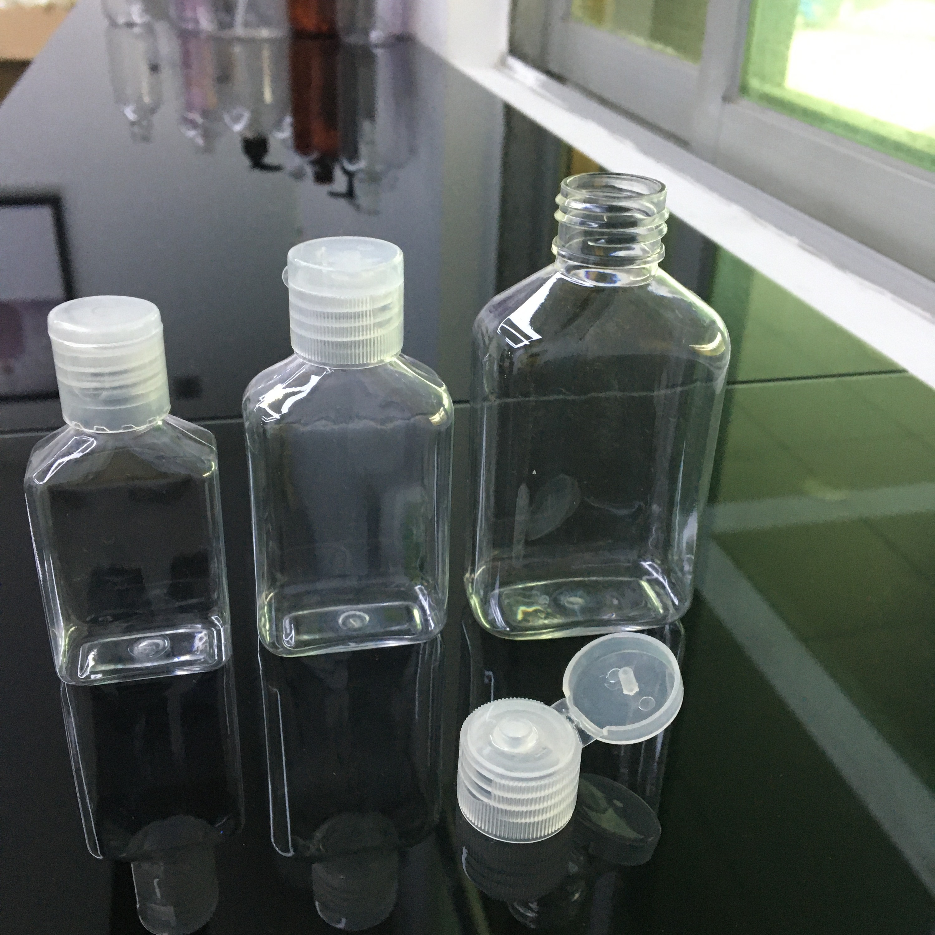 Botella de mascota con claro tapa flip top 30 ml 50 ml 100ml para botella de desinfectante de manos alcohol entrega rápida