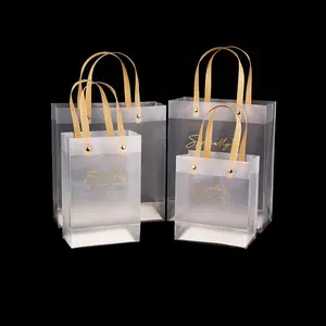 حقيبة حمل من كلوريد البولي فينيل مقاومة للماء شفافة شفافة بشعار ذهبي مخصص ختم ساخن حقيبة تسوق