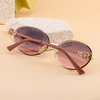 KAJILA Vente en gros de lunettes de soleil fantaisie à la mode avec logo personnalisé, monture ovale sans bordure, verres taillés en diamant, protection UV400, lunettes de soleil pour femmes