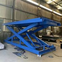 Plateforme élévatrice à ciseaux électrique fixe 4-15m, table de travail hydraulique robuste en acier jaune, capacité de charge 500kg-50000kg pour l'industrie manufacturière