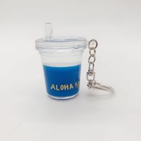 Adorable porte-clés en acrylique transparent rempli d'huile, avec perle flottante pour thé aux bulles, idéal comme souvenir et accessoire de vente au détail