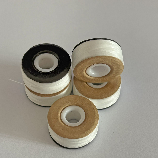 100% Polyester L Type 70D/2 60WT Single Magnetic and Paper Side Embroidery Sewing Eco-Friendly High Tenacity White Thread