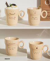 Vente en gros de tasses en céramique personnalisées à visage souriant mignon tasses à thé en grès tasses à lait petit déjeuner avec logo décalcomanies