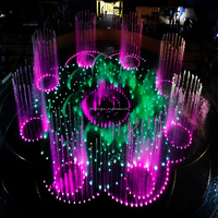 Fontaine combinée en acier inoxydable avec sculpture de lotus et jets LED RGB DMX512 pour projet de place publique emblématique
