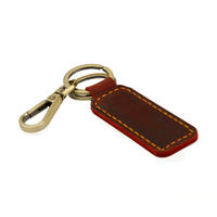 Porte-clés en cuir souple avec boussole vintage faite à la main en alliage de zinc durable et mousqueton pivotant, idéal pour un cadeau d'affaires