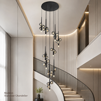 Lustre moderne minimaliste pour escalier, avec globes en verre fumé et tiges noires, idéal pour hôtel, villa, hall d'entrée, salon