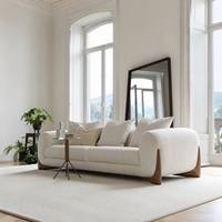Fauteuil simple nordique capitonné en tissu bouclé Teddy de forme organique, avec base en bois massif couleur noyer, pour salon, chambre et hôtel