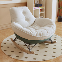Fauteuil à bascule individuel en bois, style crème, design pingouin décontracté, avec assise en forme de coquille d'œuf, pour salon et chambre