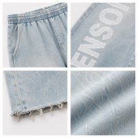 Jean ample en denim délavé pour homme avec ourlet effiloché et imprimé lettres, style streetwear décontracté, personnalisable OEM ODM