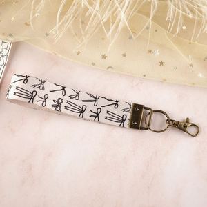 High Quality Custom Women's Short Wrist Lanyard Woven Embroidered Logo Polyester Metal Cute Custom Logo Wristband Key Holder - Product Image 6