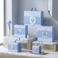 Boîte rigide portable personnalisable avec logo, motif iris bleu européen, conteneur premium avec poignée pour emballage de cosmétiques et bijoux en gros