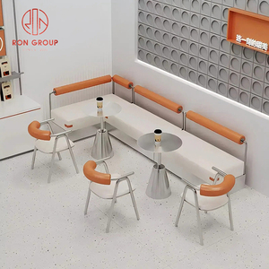 Set di Arredamento Commerciale per Ristoranti: Divano a L in Pelle Bianca per Caffetteria, Tavoli Rotondi in Metallo e Sedie Arancioni per Bar - Product Image 1