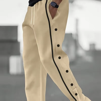 Pantalon de survêtement décontracté pour homme en polyester avec détails boutonnés, tissu tricoté couleur unie, coupe droite, taille élastique