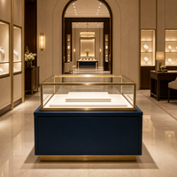 Vitrine de présentation de bijoux bleu marine personnalisée avec cadre doré pour magasin de bijoux en gros