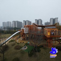 Aire de jeux modulaire extérieure avec structure métallique, toboggan tubulaire, tour d'escalade, pont en maille, équipement de parc pour enfants commercial, conception personnalisée OEM
