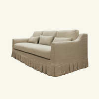 Canapé d'angle trois places en lin plissé, design français moderne et luxueux, confortable, avec pompons, pour la décoration intérieure d'hôtel