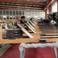Equipo de gimnasio comercial Máquina de remo de resistencia al agua de madera plegable para entusiastas del fitness Nuevo ergómetro