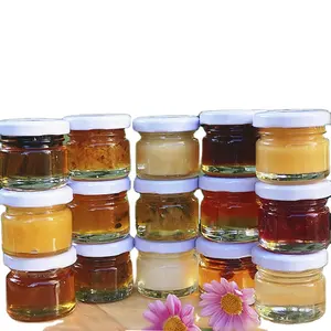برطمانات عسل شفافة سداسية الشكل برطمانات زجاجية للمربى مع أغطية معدنية 25 مل و50 مل و75 مل و100 مل للبيع بالجملة