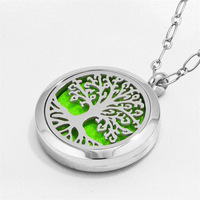 Diffuseur d'huile essentielle d'aromathérapie d'acier inoxydable collier d'arbre creux désodorisant de conception pour des cadeaux