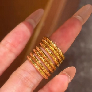 This popular Little Red Book (Xiaohongshu) item is a solid gold-plated, round, <b>plain</b> band <b>ring</b> with a closed design. It's - Product Image 4