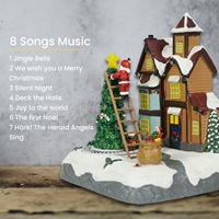 MELODY Train lumineux LED animé et rotatif, maisons de village de Noël en plastique avec 8 chansons de Noël, 3 piles AA