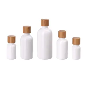 Bottiglia di olio essenziale di vetro opale 30ml 50ml 100ml 200ml bottiglia di olio essenziale di vetro bianco con tappo di bambù