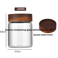 Vente en gros de récipient de stockage des aliments en verre borosilicaté à haute teneur en borosilicate cylindre de bocal transparent avec couvercle en acacia