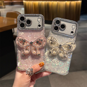 Funda para iPhone 17 16 15 Pro Max con diseño de mariposa, diamantes y concha degradada, lazo ombré, cubierta trasera de cristal con purpurina láser y diseño de corazón para la cámara - Product Image 3