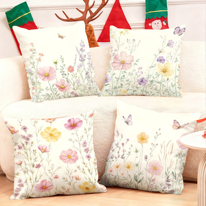 Coussins décoratifs floraux avec des papillons pour une canapé confortable près de chaussettes de Noël et de bois de cerf - Product Image 1