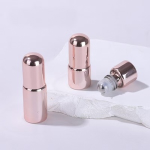 Botellas cilíndricas de oro rosa de 1 ml para cuidado personal, recargables, con tapa de bola giratoria - Product Image 1