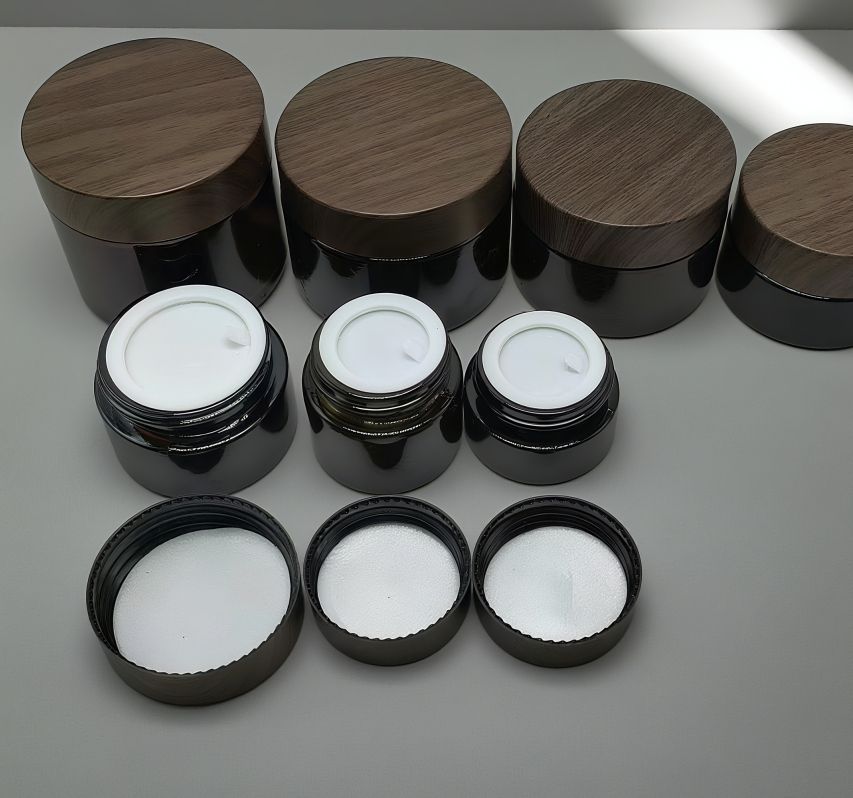 black glass jar with plastic wood grain lid