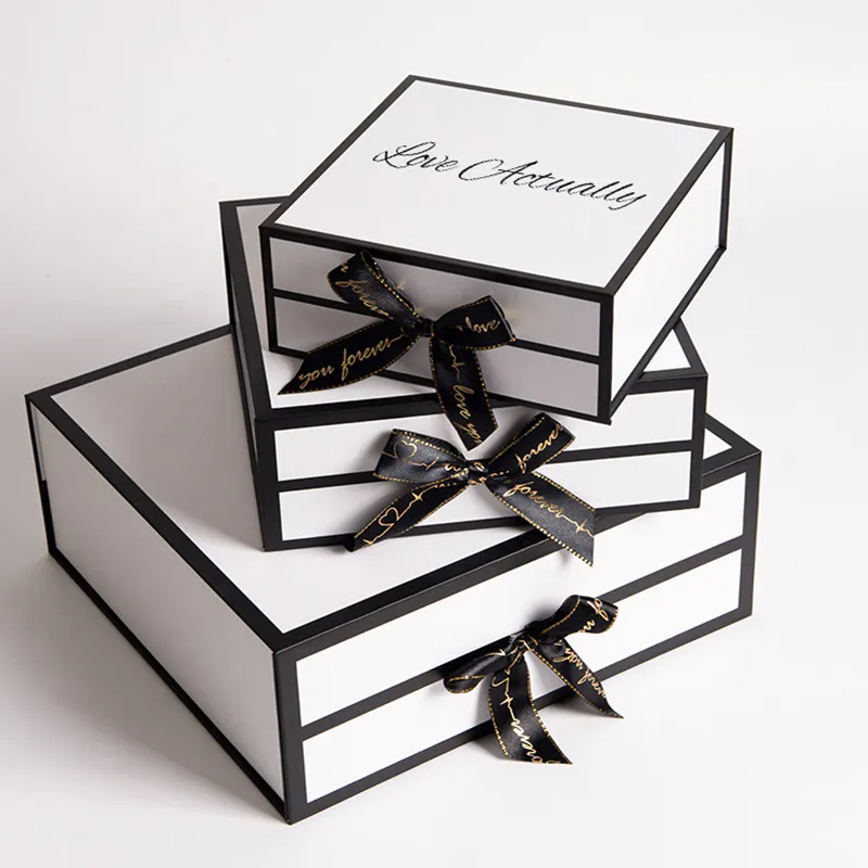 Custom Luxury White Gift boxes Cosmetic Skincare Packaging Box Foldable Magnetic Closure Gift Boxes With Black Ribbon