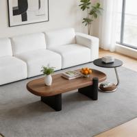 Table basse ovale moderne et créative avec éclairage de luxe, mobilier haut de gamme pour petits salons et appartements.