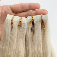 Vente en gros d'extensions de ruban de trame de peau d'injection 100 cheveux humains ruban invisible dans les extensions bloc-notes de cheveux russes établis