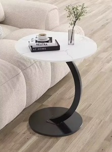 طاولة قهوة دائرية بقاعدة دعم على شكل قوس يمكن وضعها أسفل الأريكة. - Product Image 6