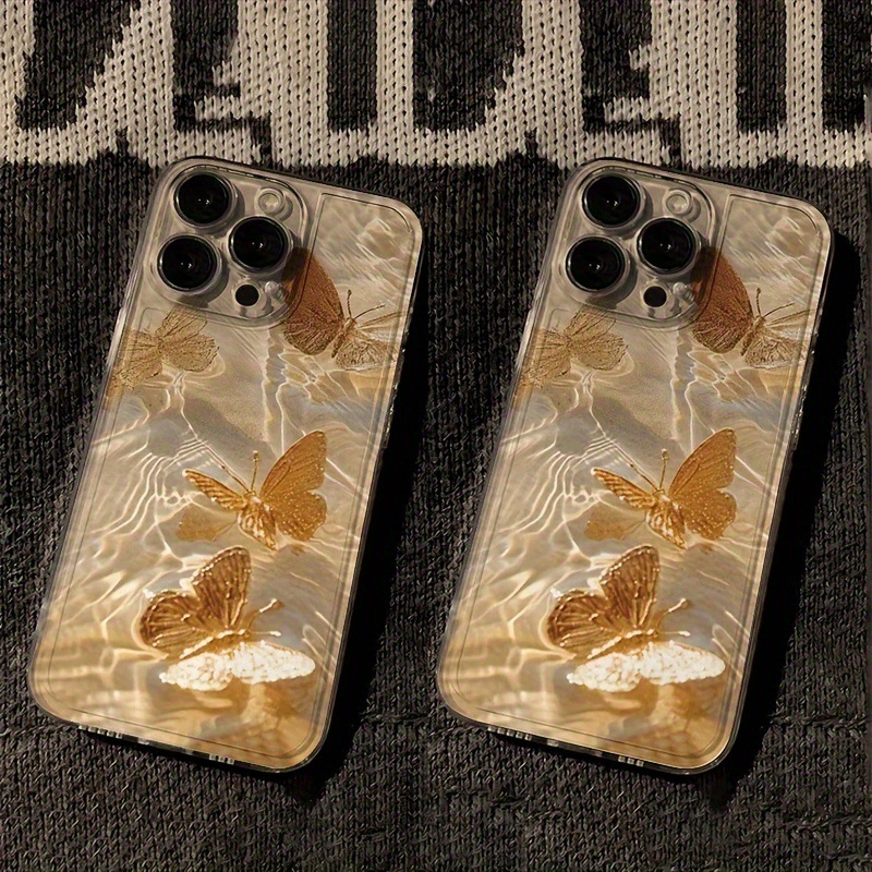 Golden butterfly on the water's ripples