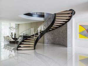 Escalier intérieur moderne et durable en métal courbé avec garde-corps en verre, construction en acier inoxydable et bois, design contemporain pour - Product Image 4