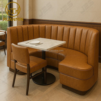 Ensemble de canapés en forme de U de luxe moderne avec revêtement en cuir PU et tables rondes en marbre pour restaurants, hôtels et salles de banquet
