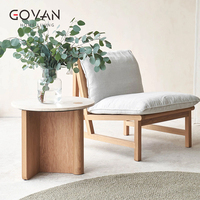 Table basse en bois massif de style nordique avec plateau en travertin, idéale pour les zones d'accueil à domicile et les hôtels