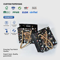 Sac en papier noir de luxe léger en carton, avec poignées en corde, pour magasin de vêtements, sac de shopping, emballage de vêtements, sac cadeau, personnalisable