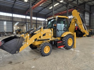 รถตักแบคโฮสีเหลือง CAT420F พร้อมบุ้งกี๋หน้าและแขนขุดหลัง น้ำหนัก 7000 กก. ใช้งาน 0-2000 ชั่วโมง ในสภาพแวดล้อมคลังสินค้า - Product Image 1